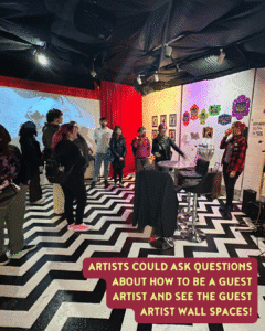 A group of people stands in a gallery space with patterned floors and art on the walls, listening to a speaker near a stool. Text overlay discusses guest artist opportunities.